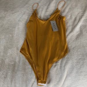 Mustard color soft one piece never worn